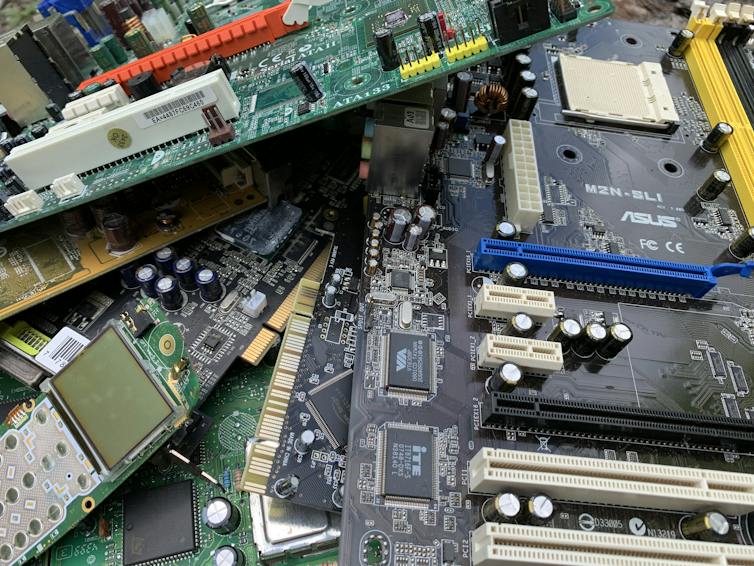 Multiple printed circuit boards laid on top of one another.